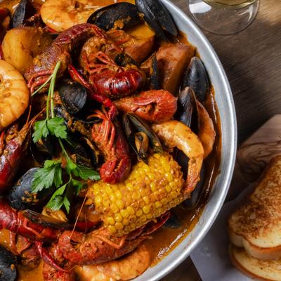 Mega set, seafood combo with potatoes and corn on the cob, close up.