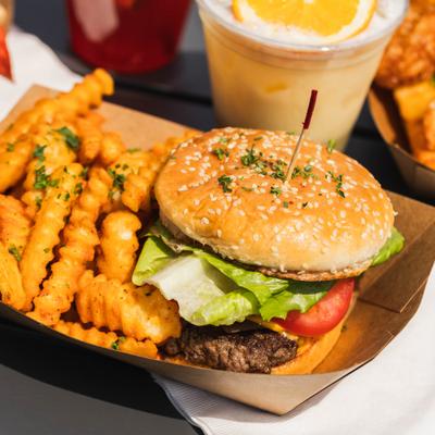 Smashburger topped with lettuce and tomato, served with crinkle-cut fries.