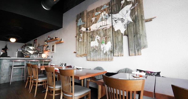 Interior, tables ready for guests, wall decorations