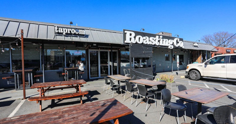 Exterior, uncovered seating area, wooden tables with benches, regular tables for four