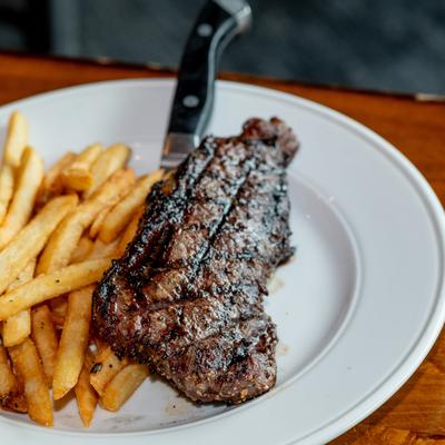 Strip steak served with French fries.