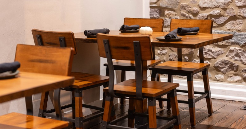 Restaurant seating area with wooden tables and chairs