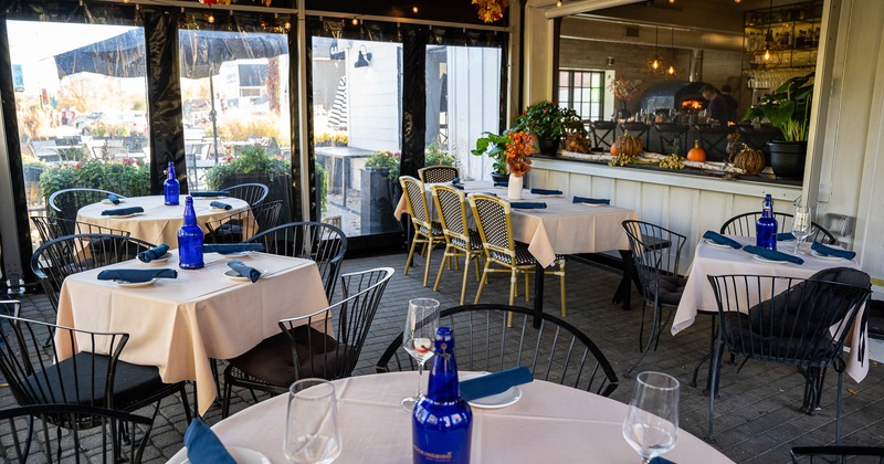 Interior, tables set for guests in dining area