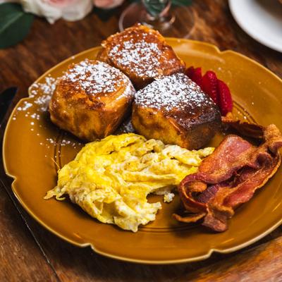 Hawaiian roll French toast, scrambled eggs and bacon.