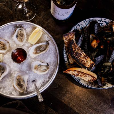 Raw oysters, mussels, and toast.