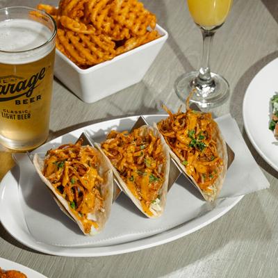 Shrimp tacos, waffle fries, and beer.