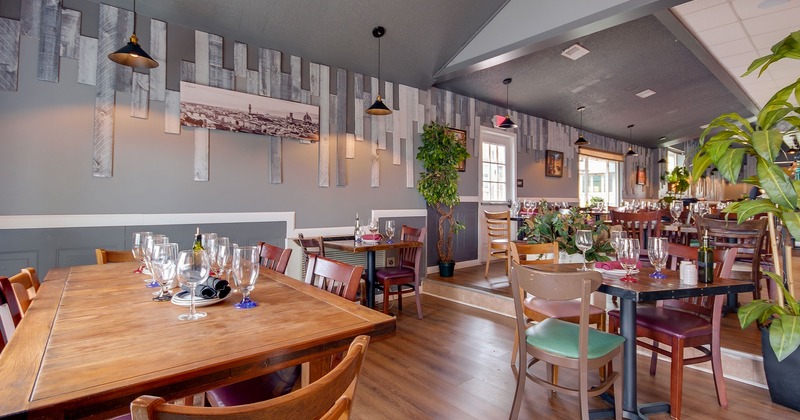 Interior, dining area, tables with tableware and glasses
