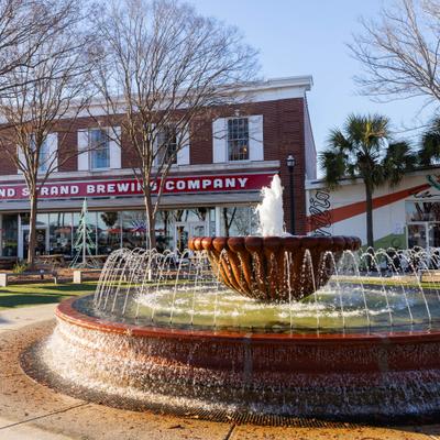 Fountain in front of Grand Strand Brewing Company building.