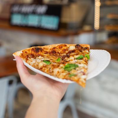 Slice of BBQ Chicken pizza.