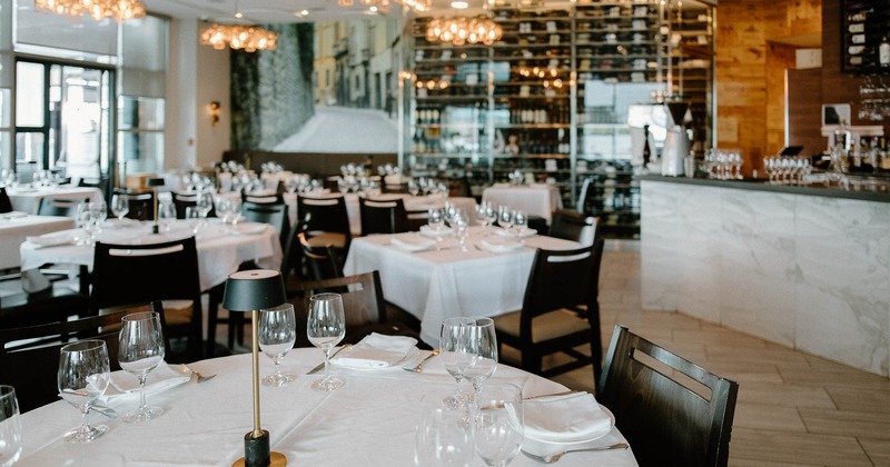 Interior, dining area with bar in the back