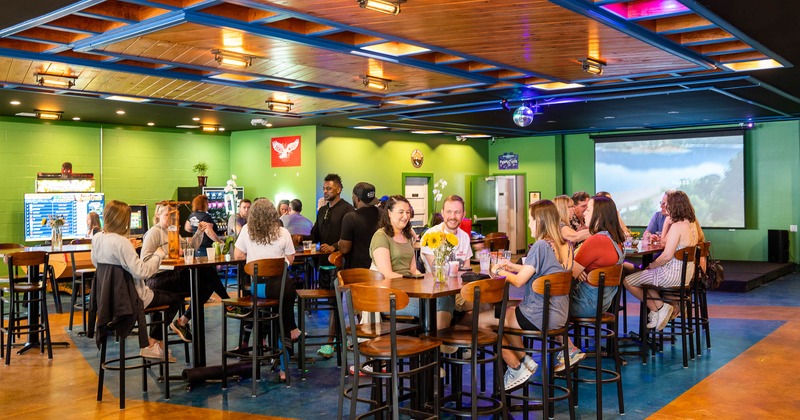 Interior, seating area full of guests