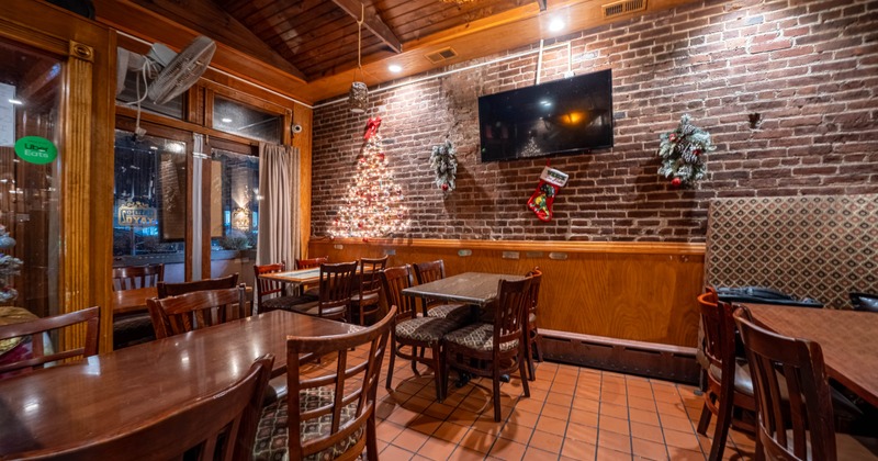 Interior, chairs and tables, TV on the wall