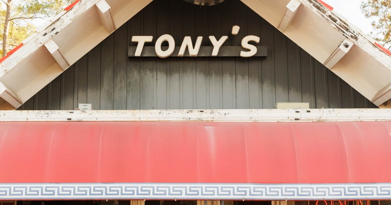Store front with entrance and a sign