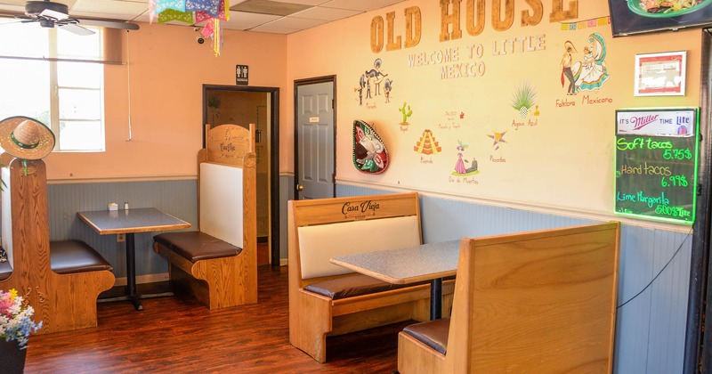 Interior, booth seating area with wall decoration