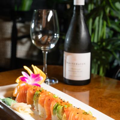 Wild River roll served with a glass and bottle of wine.