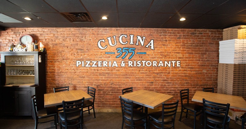 Interior, tables, chairs, logo on the wall