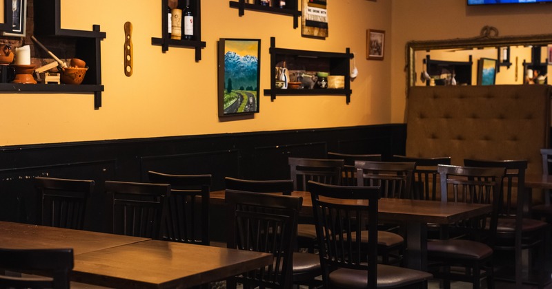 Dining space with wooden tables and chairs