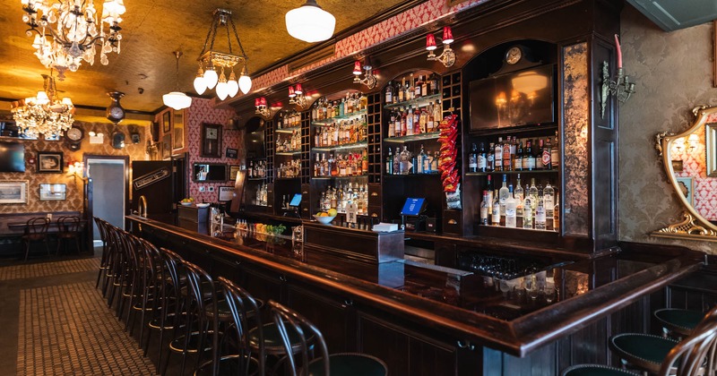 Bar area, neatly lined up bar stools