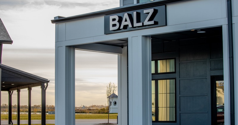 Exterior, entrance and sign above, side view