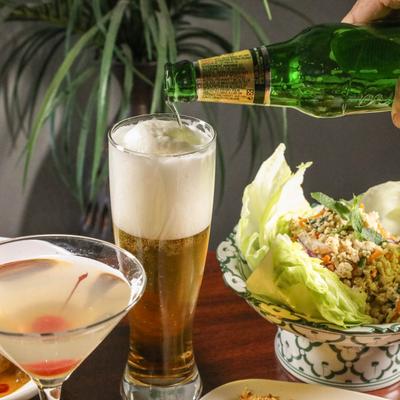 Lychee Martini, A glass of beer, and Larb salad.
