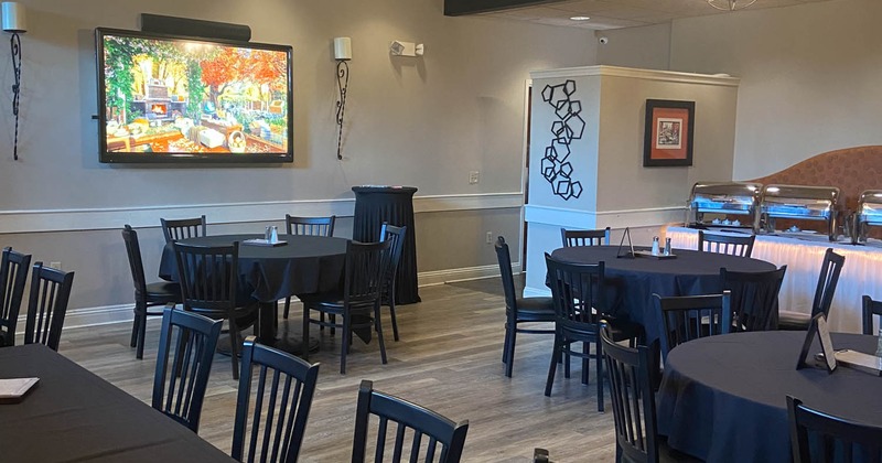 Interior, dining area, TV on the wall