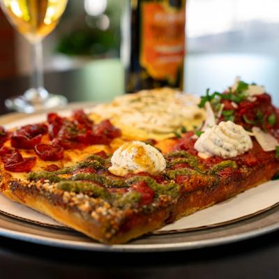 Square pizza with various toppings.