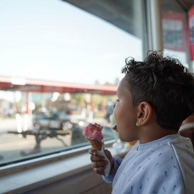enjoying strawberry cone.