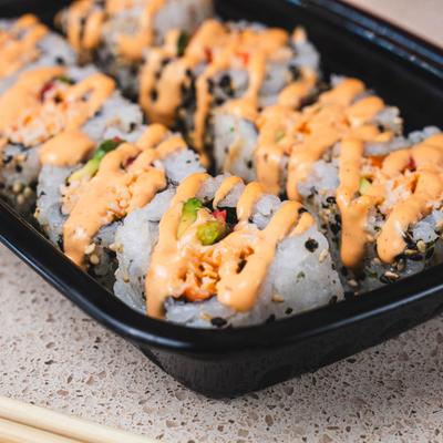 Spicy Crab Rolls, with tomato, jalapeno, avocado, and chili garlic aioli.