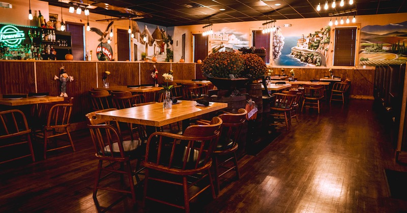 Interior, tables and chairs, a wall with art and decorations