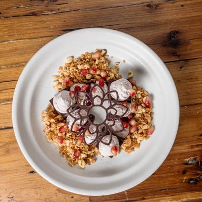 Chocolate-Hazelnut Cremeux topped with chocolate garnish.
