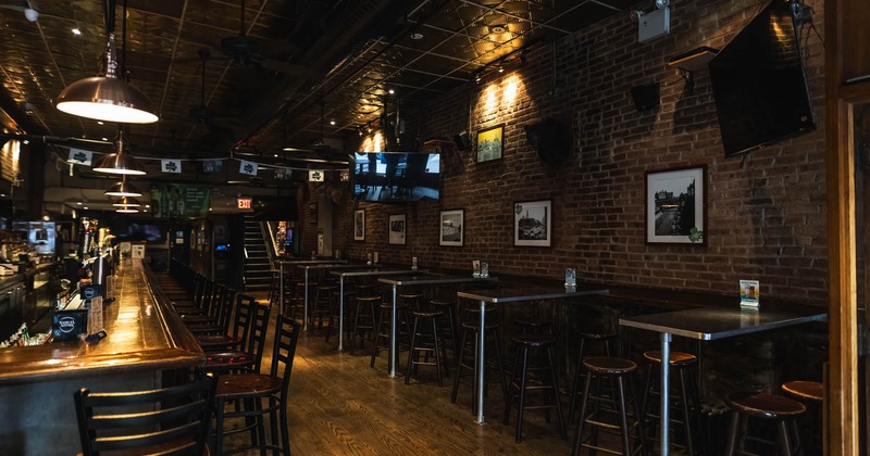 Interior, bar and high seating area, wooden top bar with stools, high tables with chairs