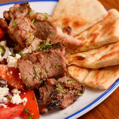 Lamb with cheese, vegetables and side of pita bread
