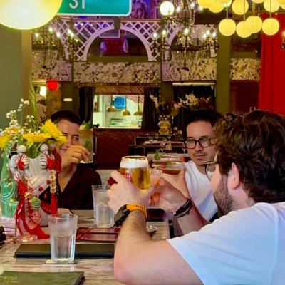 People toasting at the bar.