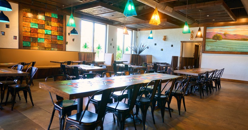 Interior seating area with chairs and tables, colorful decoration