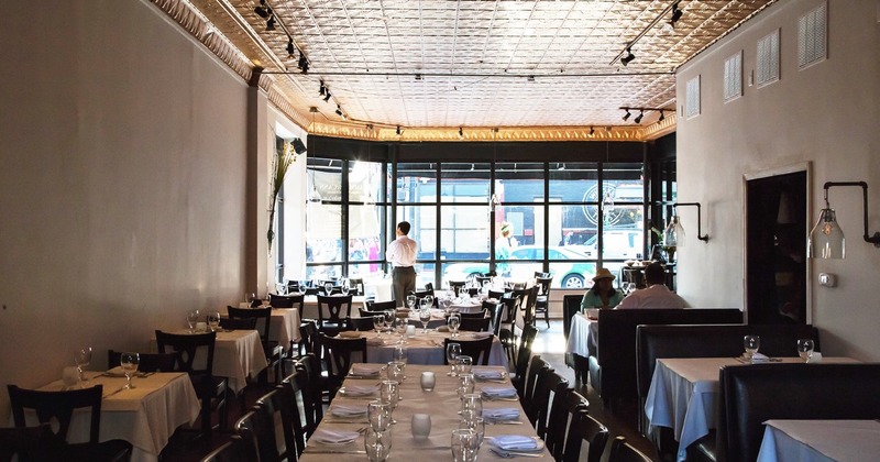 Interior, tables lined up, ready for guests