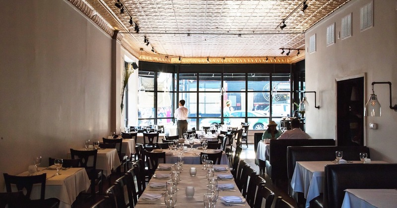 Interior, tables lined up, ready for guests