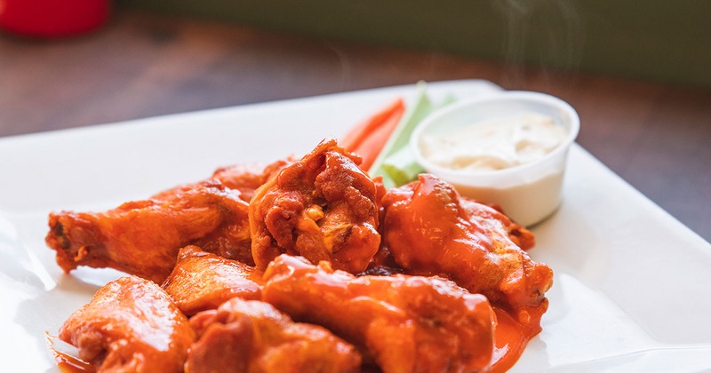 Buffalo wings served with blue cheese and celery sticks