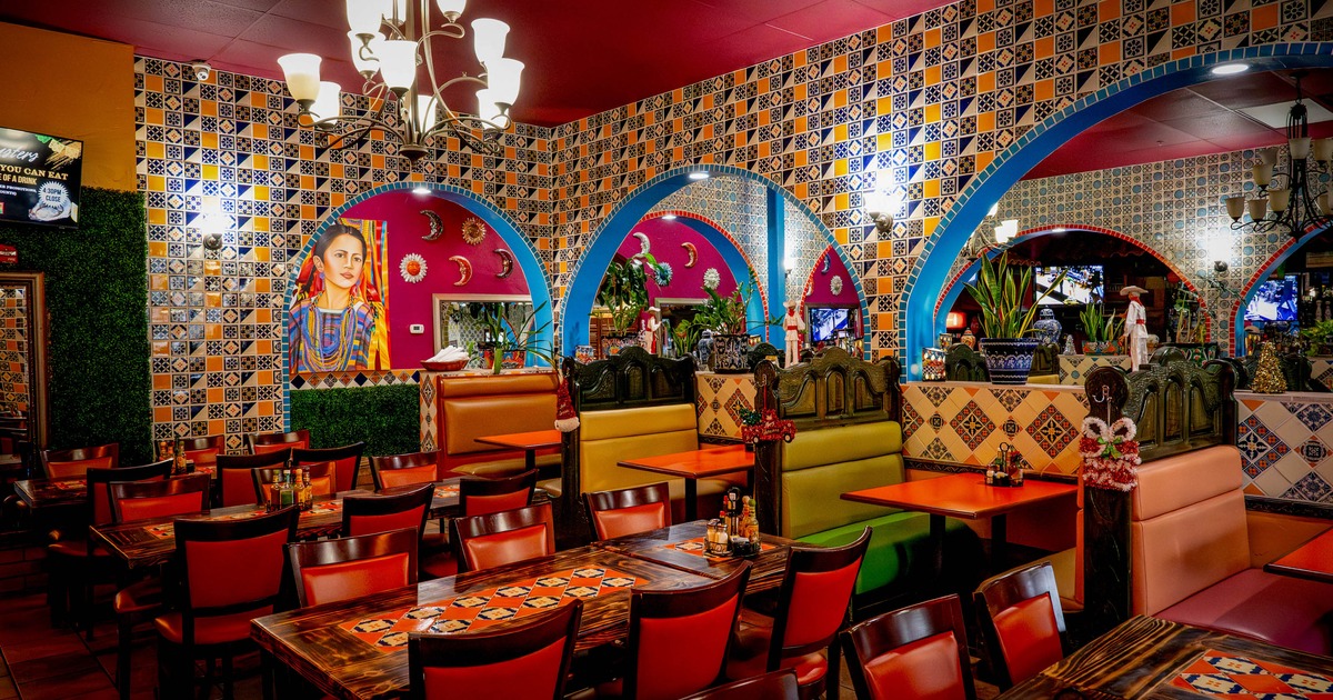 Interior seating area with tables, chairs and double booths