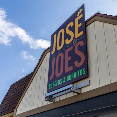 Restaurant name sign on the building.