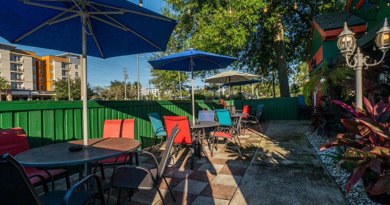Restaurant patio with tables, chairs and umbrellas