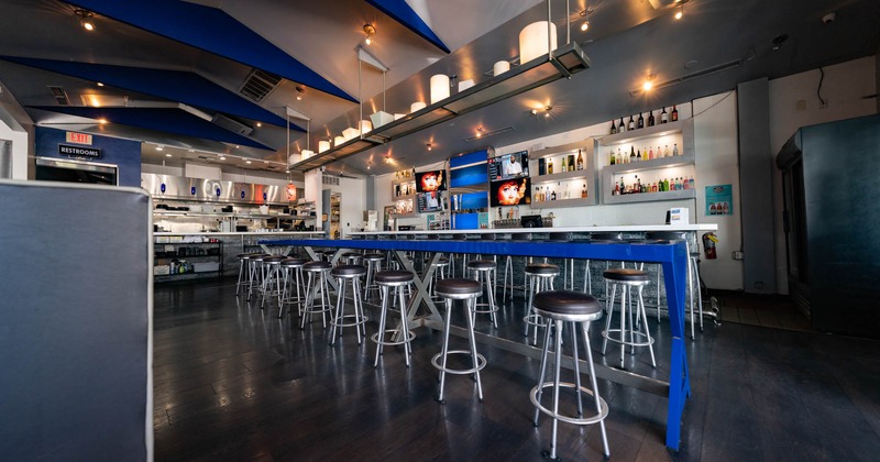 Seating area, tall, long table and  bar stools
