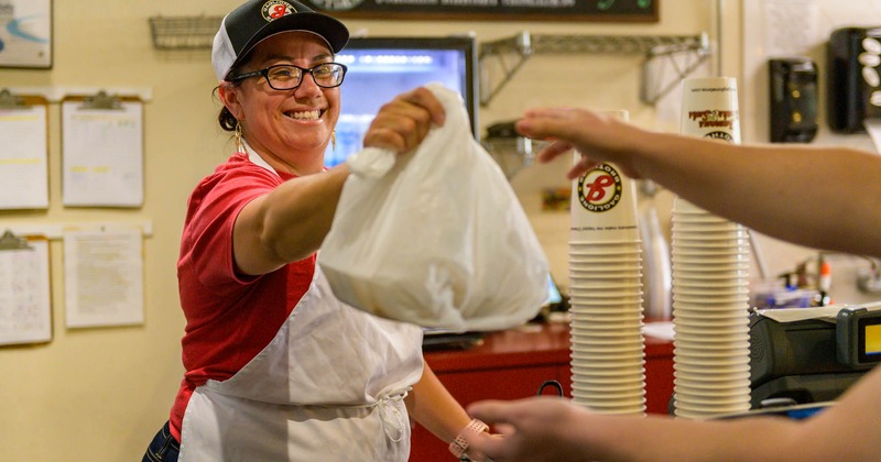 Employee serving a customer