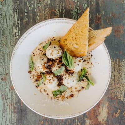 Artichoke Heart with garlic butter, mornay, Parmesan, basil, and balsamic crumble.