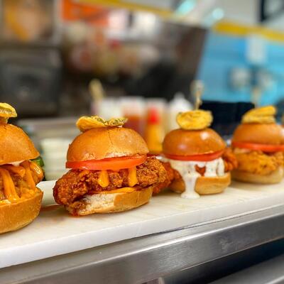 Chicken sliders on a counter.
