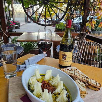 Food and drinks on a table outside.