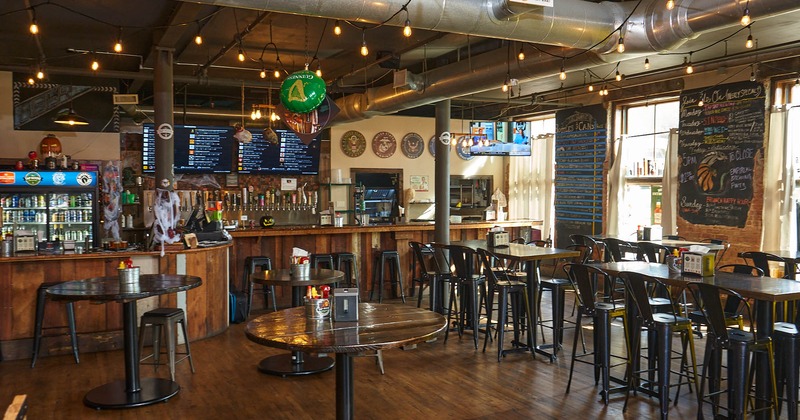 Interior, pirate decorative skull hanging on a hook, fishnet, tables, chairs, counter