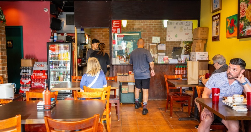 Interior, diner area, guests, food counter