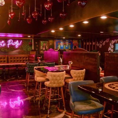 Interior, seating areas, with high tables, chairs and banquette seatings.