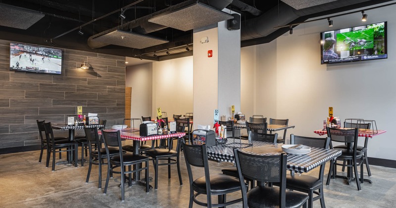 Interior, seating area, TVs on the wall