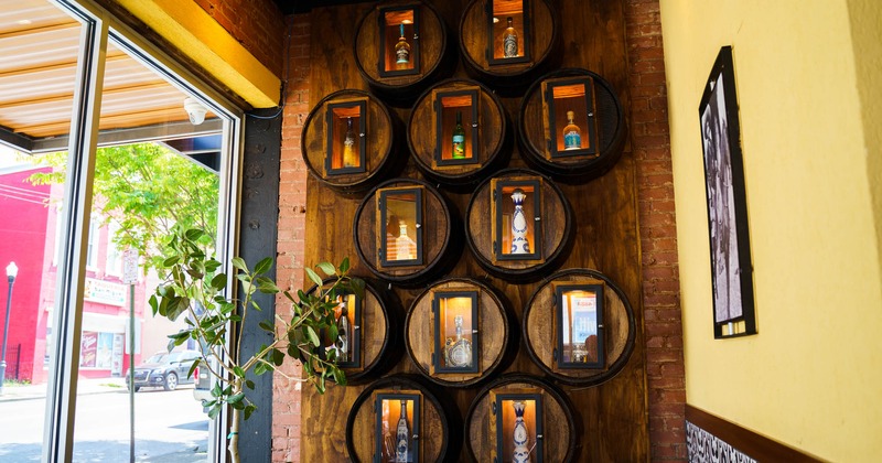 Interior, table, wooden deco wall with wine and tequila specials